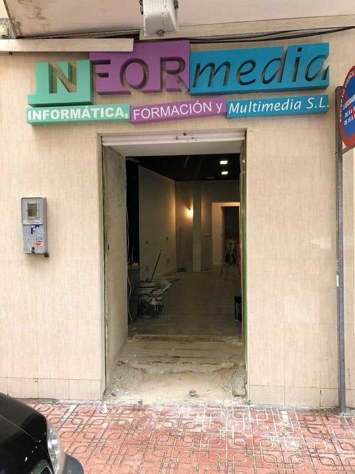 The street front with the InforMedia sign over the door